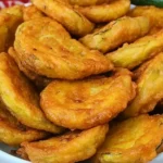 Crispy fried zucchini rounds with golden-brown crunchy coating